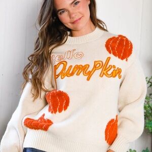 Chic Cream Sweater with Orange Accents